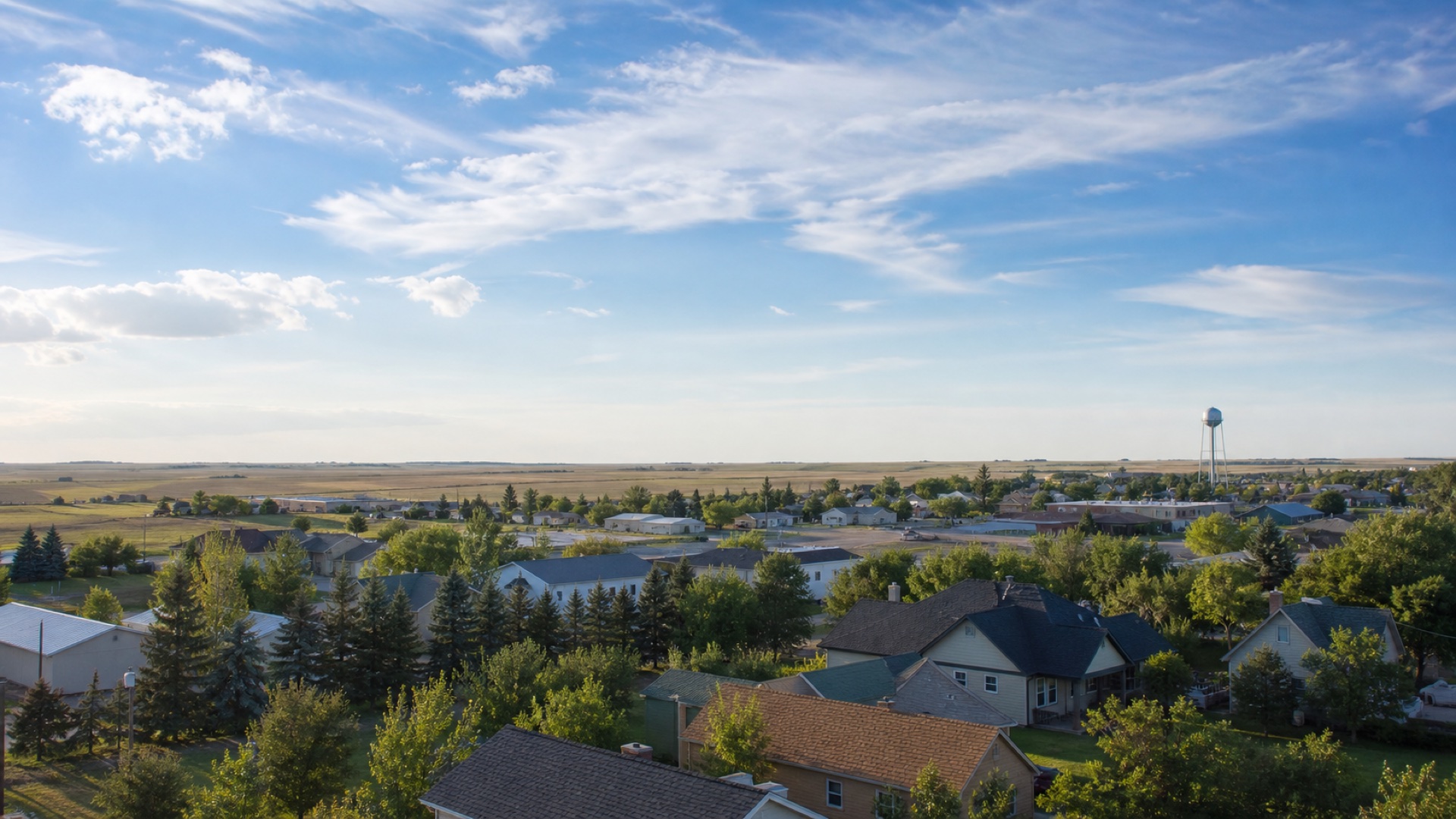 North Dakota prairie community with varied residential and low commercial roofs